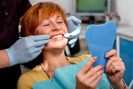 Dr. Aaron Tropmann   Dr. Gary Oyster  | Dentures, Full Mouth Reconstruction and Dental Cleanings